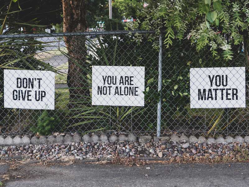 posters that read  Dont give up, you are not alone, you matter